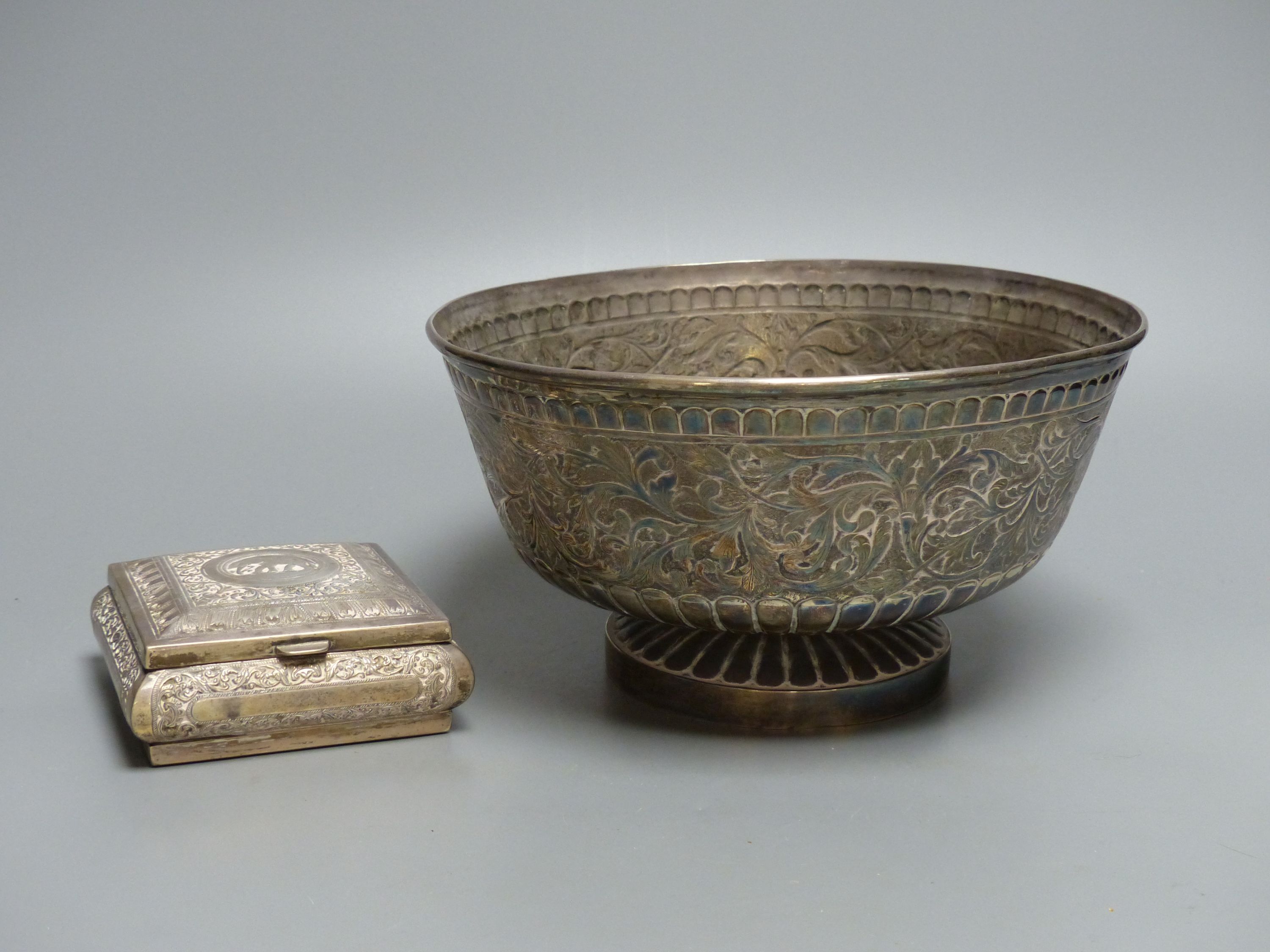 An Indian? white metal bowl, on pedestal foot, height 12.8cm, 23oz and a similar small white metal mounted cigarette box.
